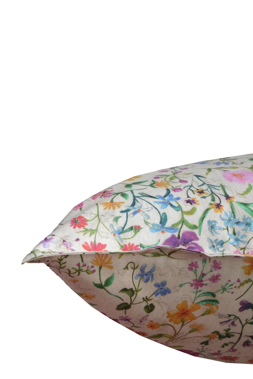 Floral-patterned pillow on a white background