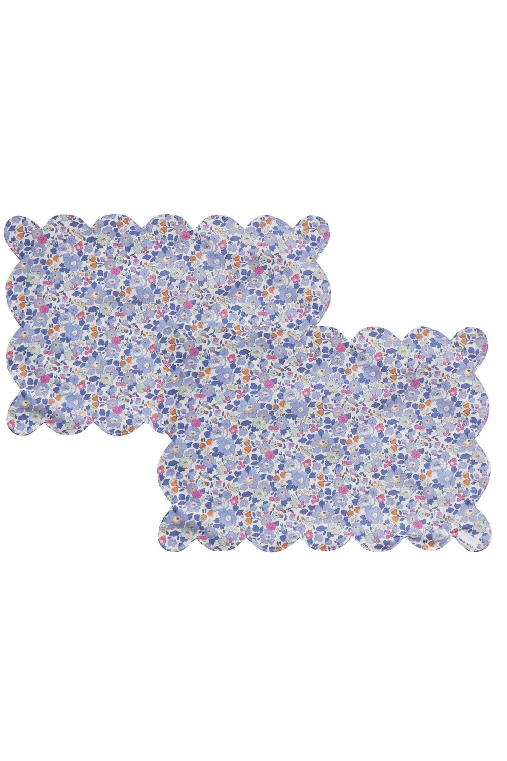 Two Liberty floral-patterned placemats on a white background