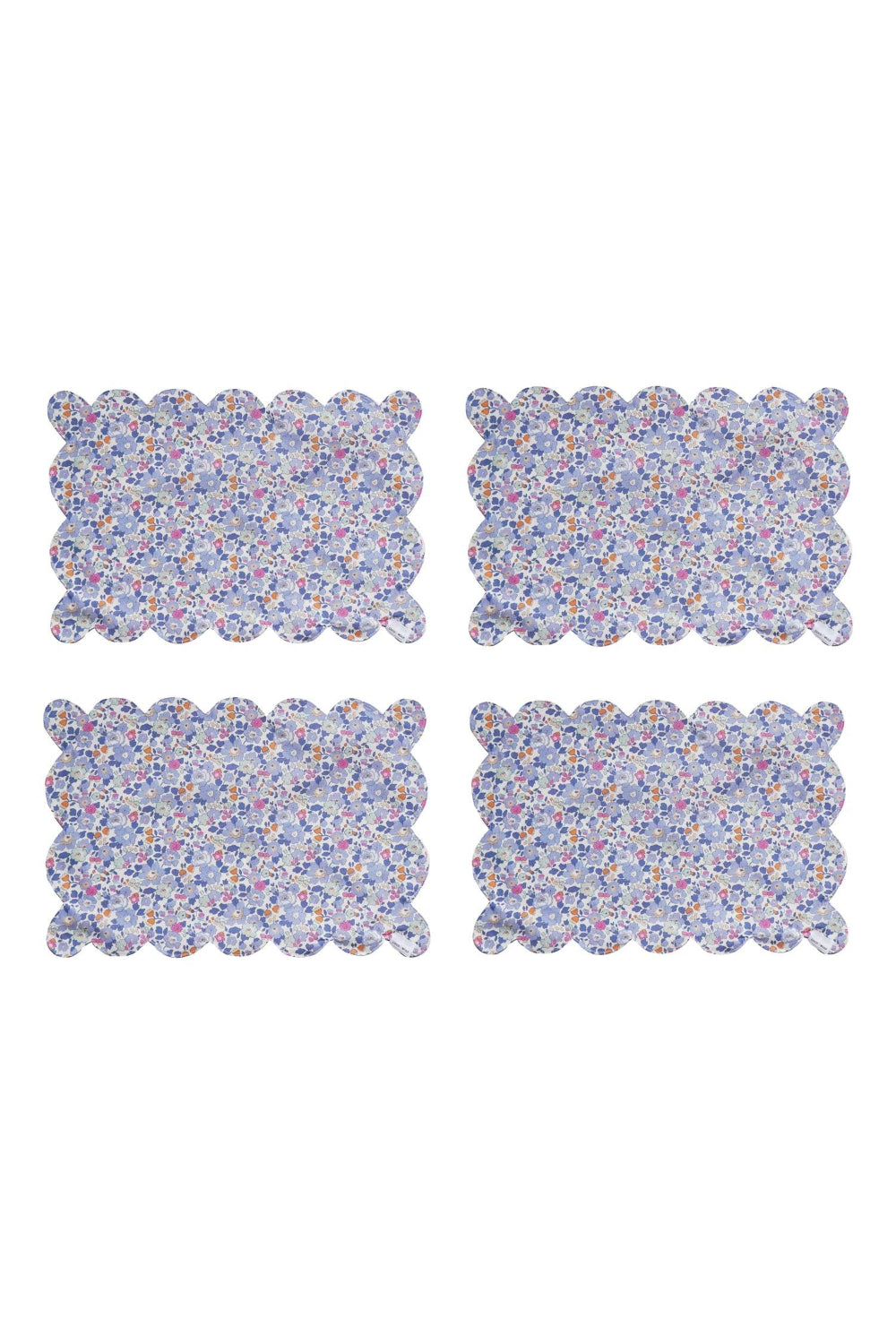 Four Liberty floral-patterned placemats on a white background