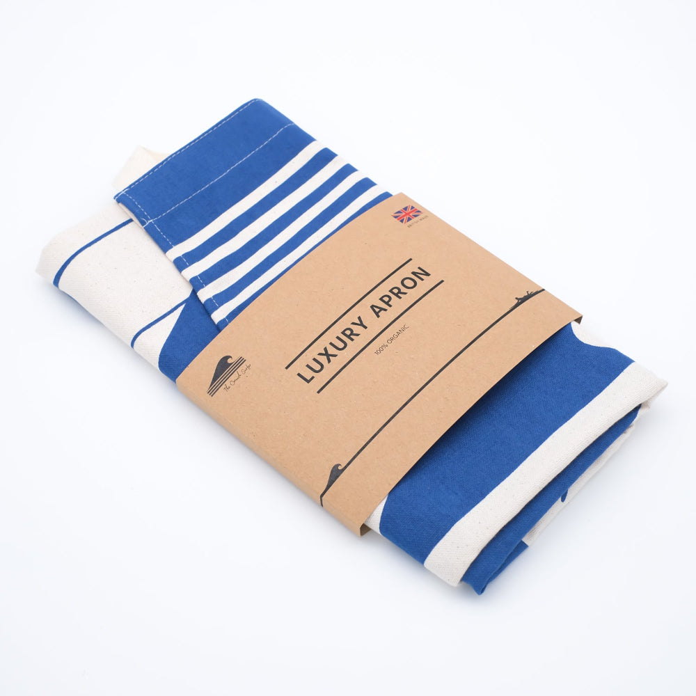 Blue and white striped apron on a cardboard stand with 'Luxury Apron' text.