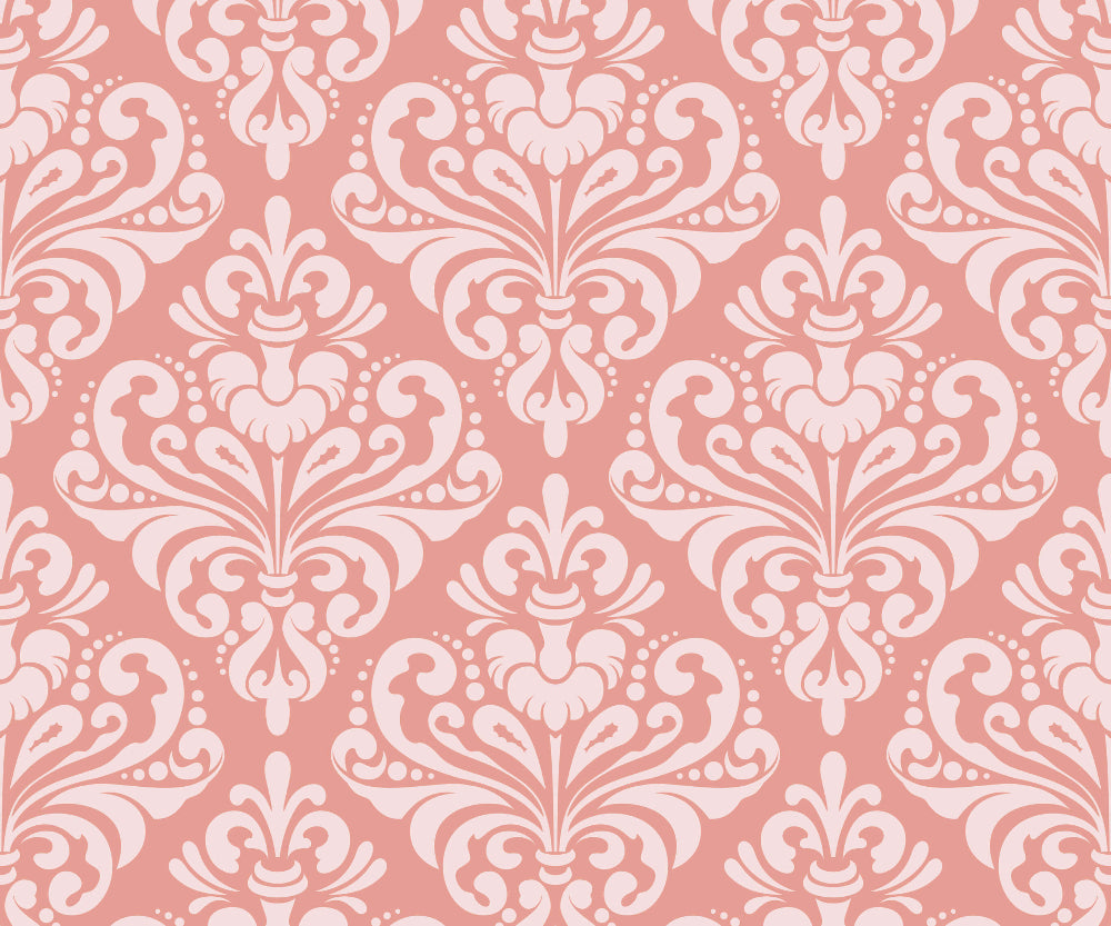Decorative Damask patterned wallpaper with white flourishes on a pink background