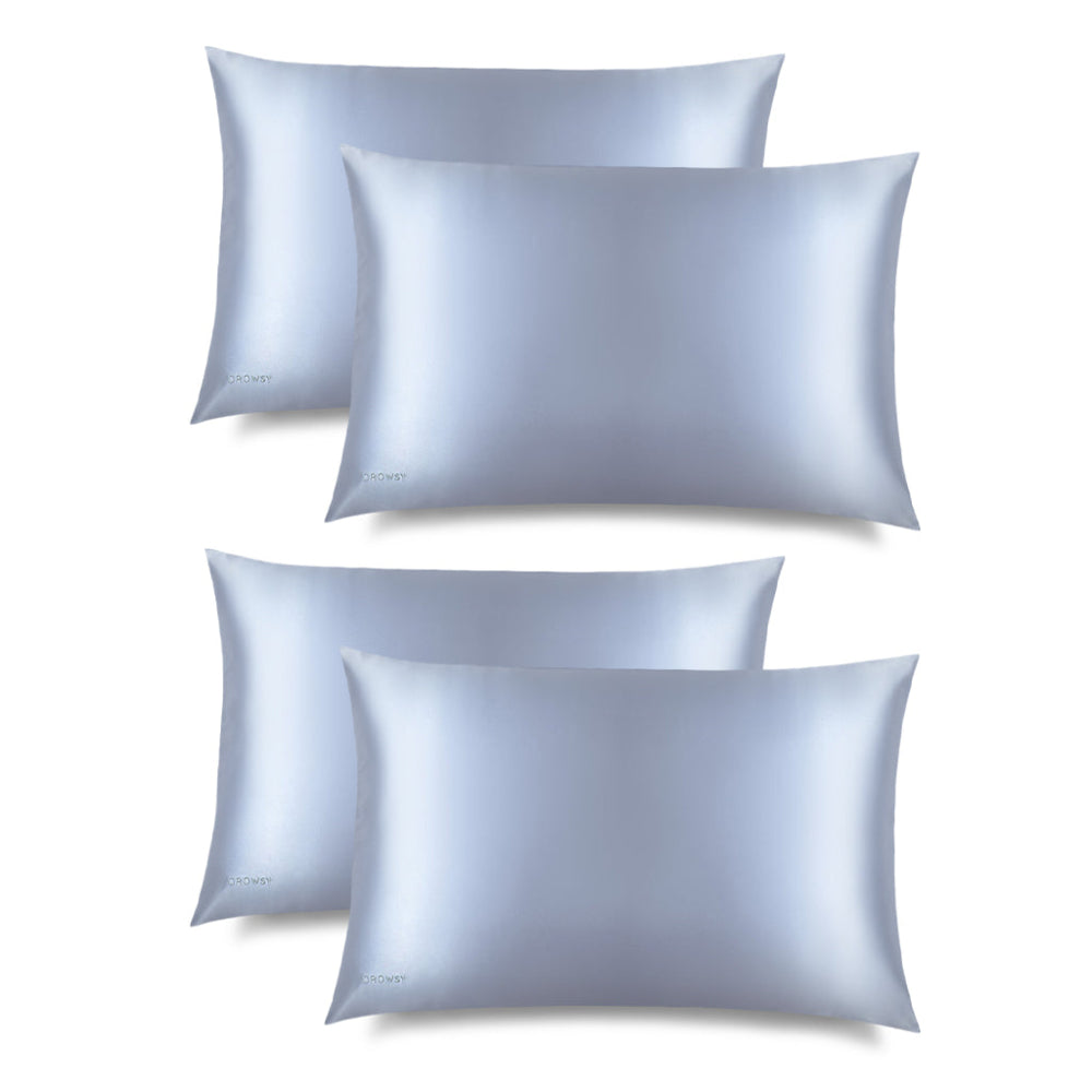 Set of four light blue belle silk pillowcases on a white background
