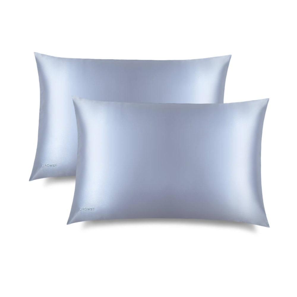 Two light blue belle silk pillowcases on a white background with Drowsy logo
