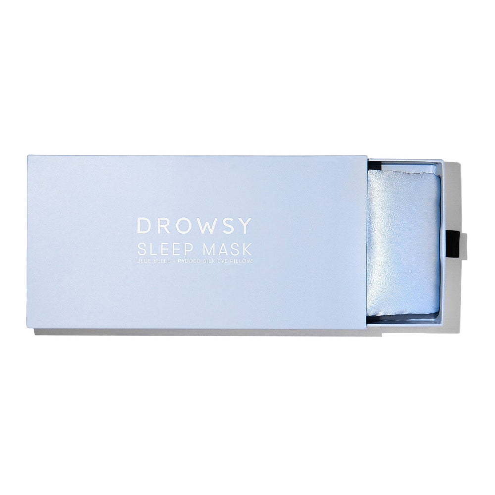 Sleep mask in a light blue box on a white background