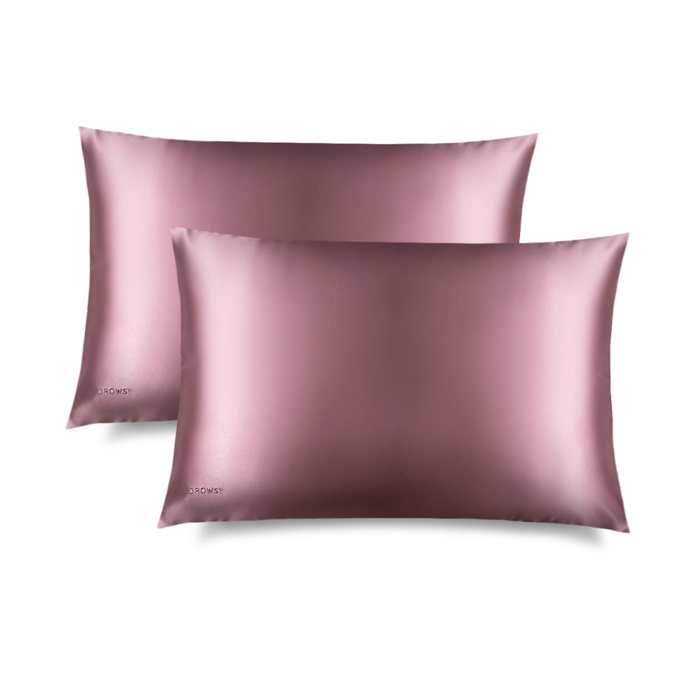 Two Drowsy Damask pink silk pillowcases  with a sheen on a white background
