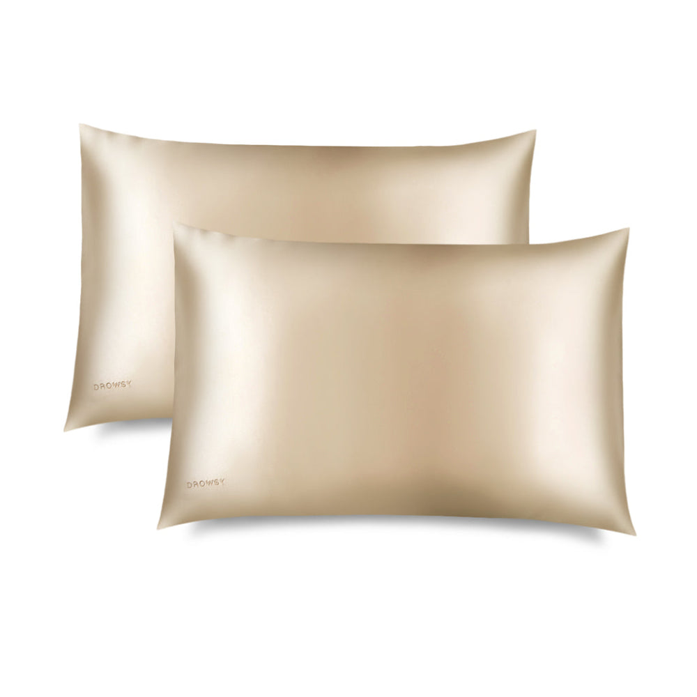 Two Dusty Gold pillowcases on a white background