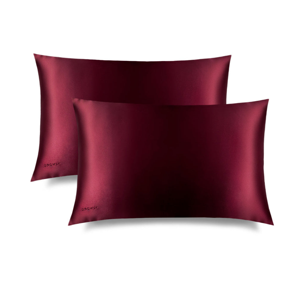 Two Drowsy La Vie En Rouge pillowcases on a white background