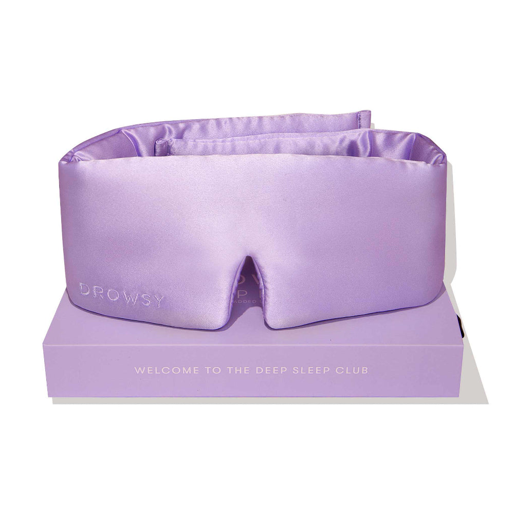 Drowsy Purple sleep mask on a purple box with text 'Welcome to the deep sleep club'