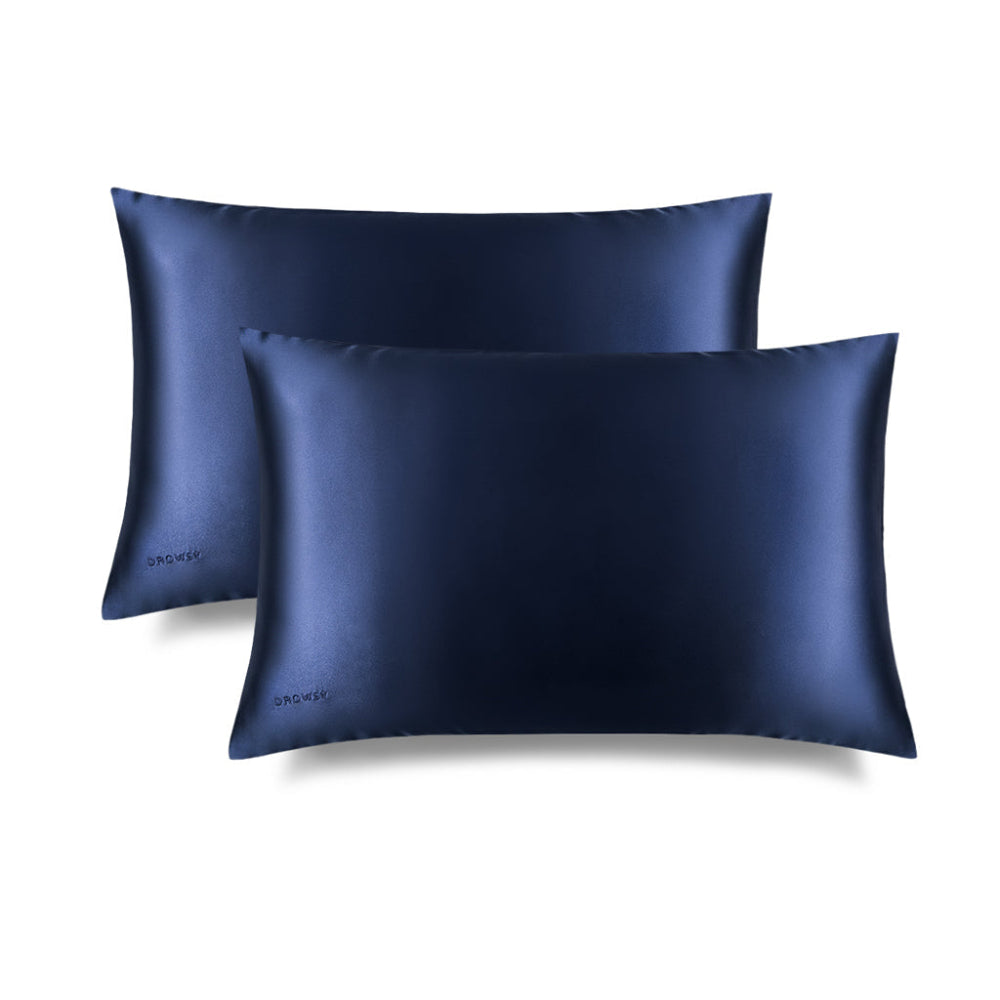 Two Midnight blue silk pillowcases on a white background