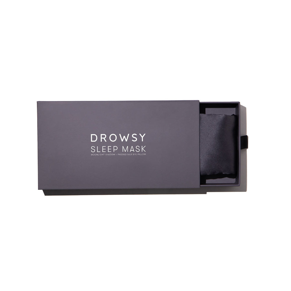 Moonlight Shadow silk sleep mask in a grey box with 'Drowsy Sleep Mask' text.