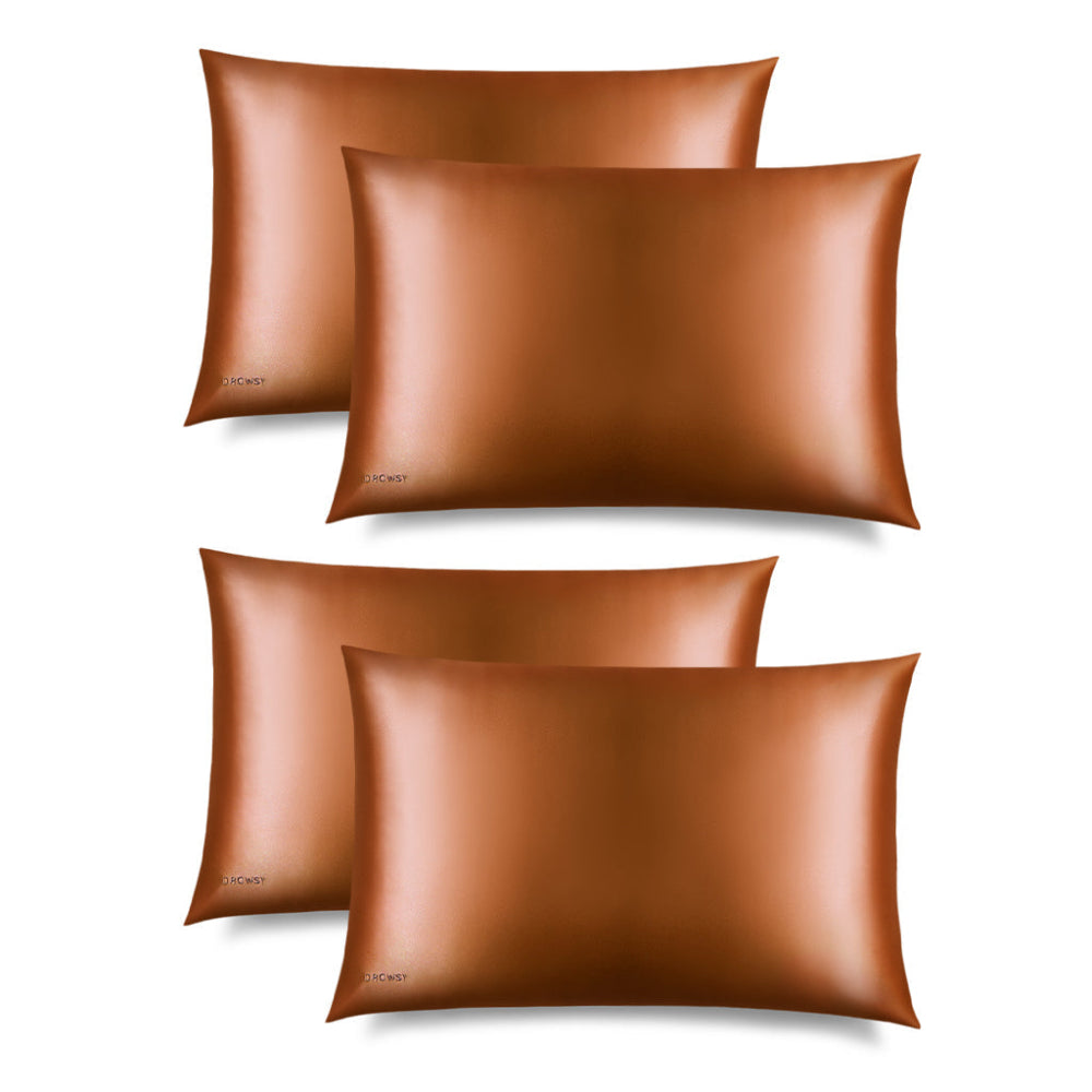 Four Drowsy Pumpkin spice silk pillowcases on a white background