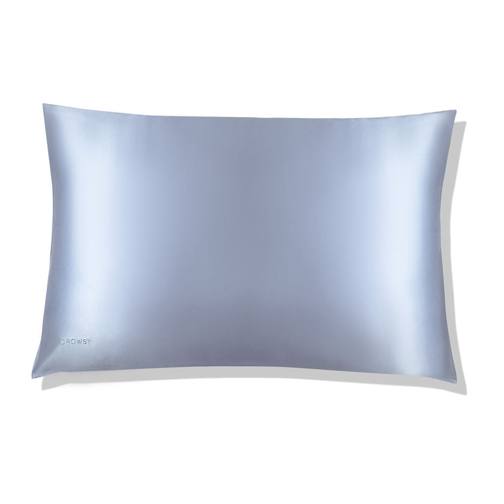 A Drowsy silk blue belle pillowcase with a luxurious sheen on a white background