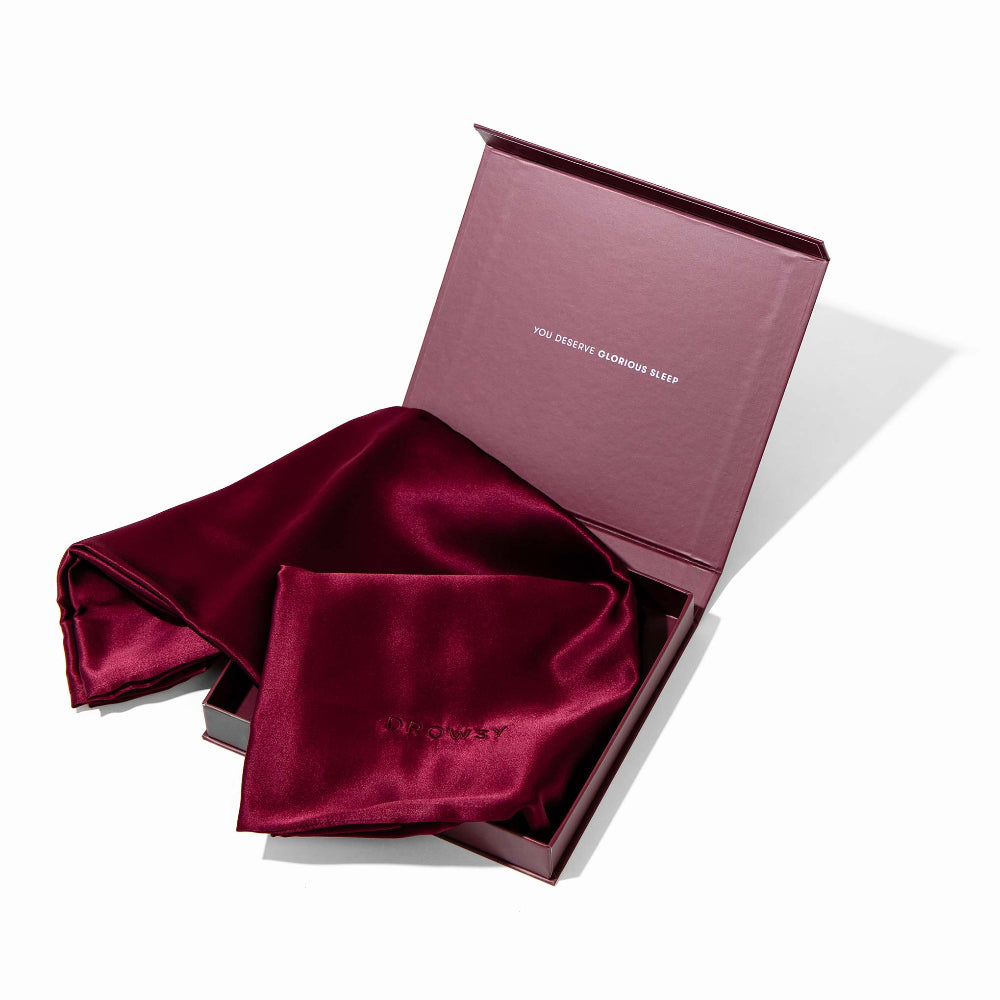 Drowsy La Vie En Rouge Silk pillowcase in a pink box on a white background