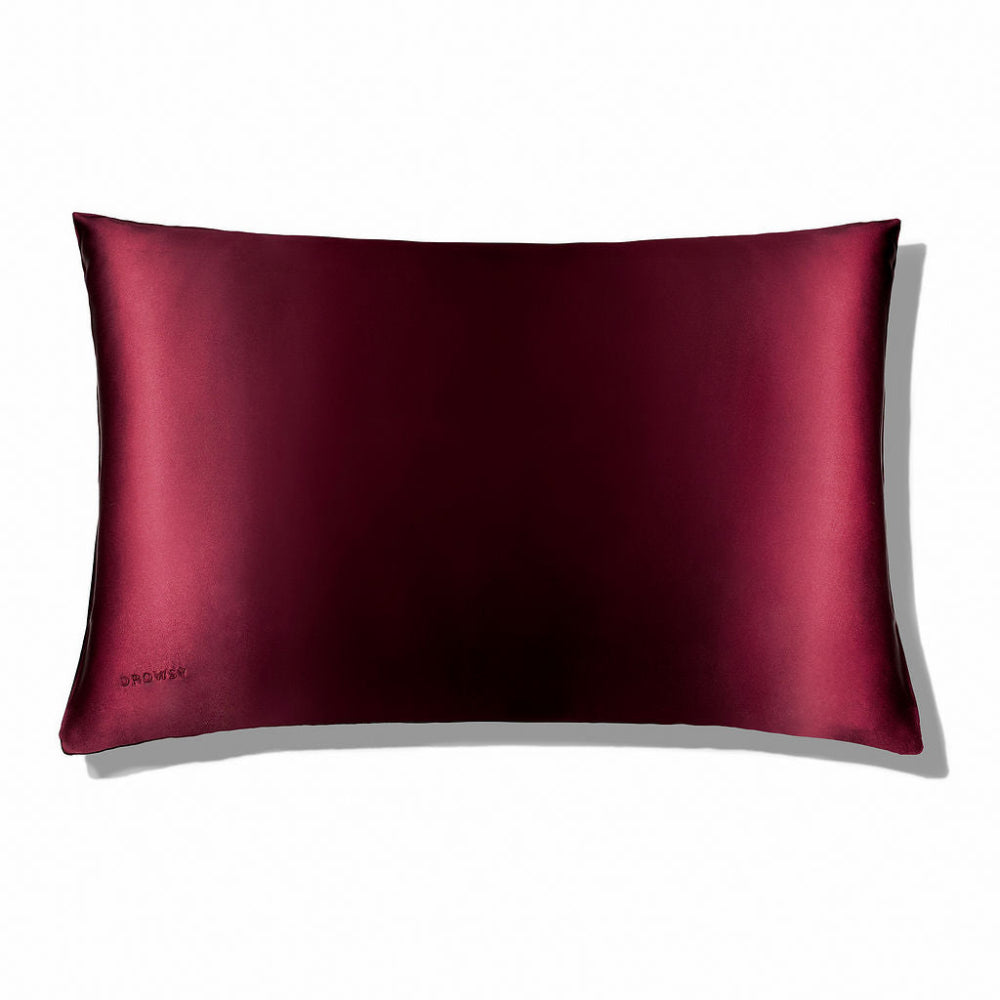 Drowsy La Vie En Rouge red silk pillowcase with a luxurious sheen.
