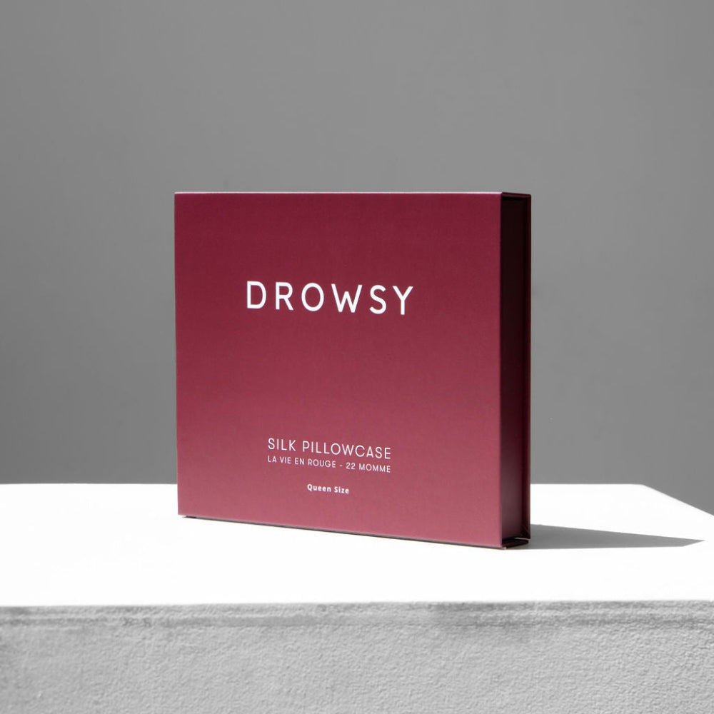 Drowsy La Vie En Rouge Red box with 'DROWSY' and 'SILK PILLOWCASE' text on a neutral background