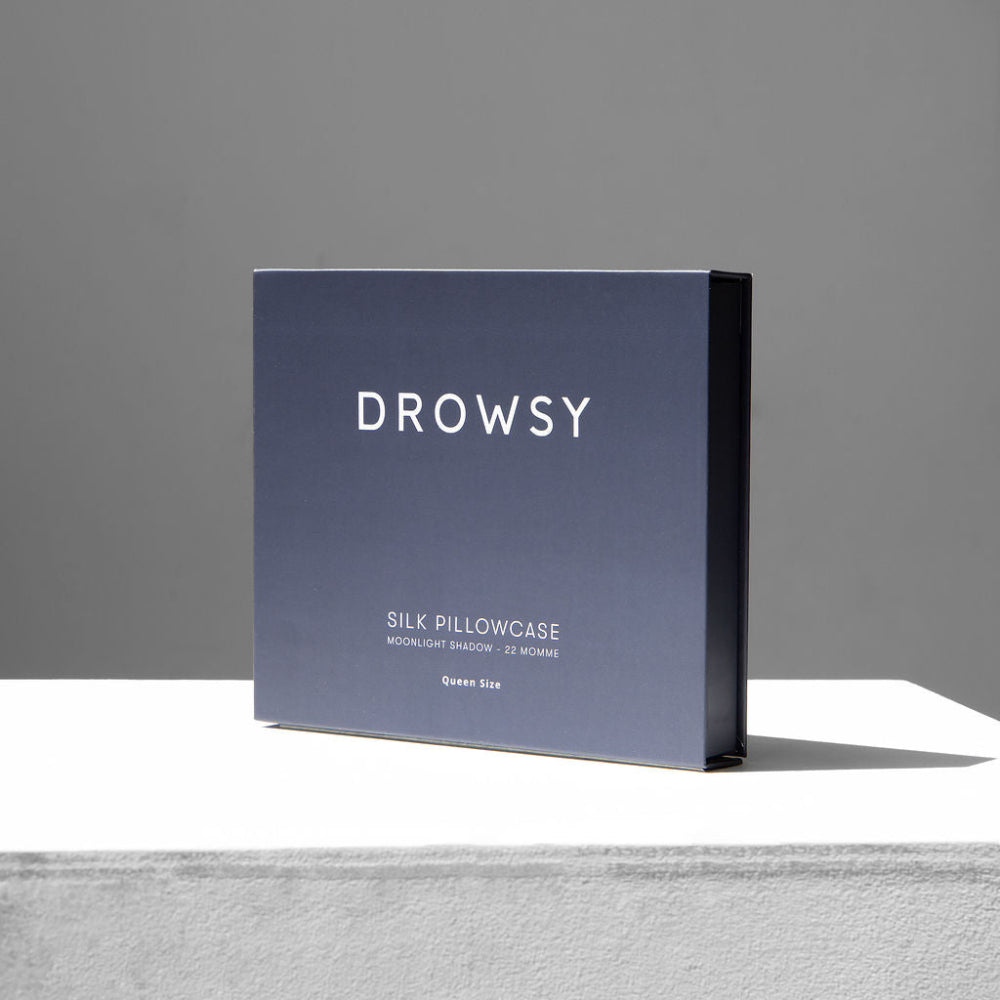 Drowsy Moonlight shadow silk pillowcase in packaging box on a light grey background