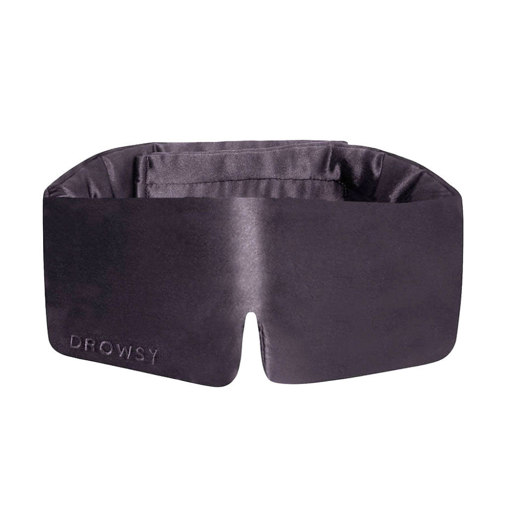 A grey moonlight shadow silk sleep mask with a soft, padded design and the brand name 'DROWSY' visible on the front.