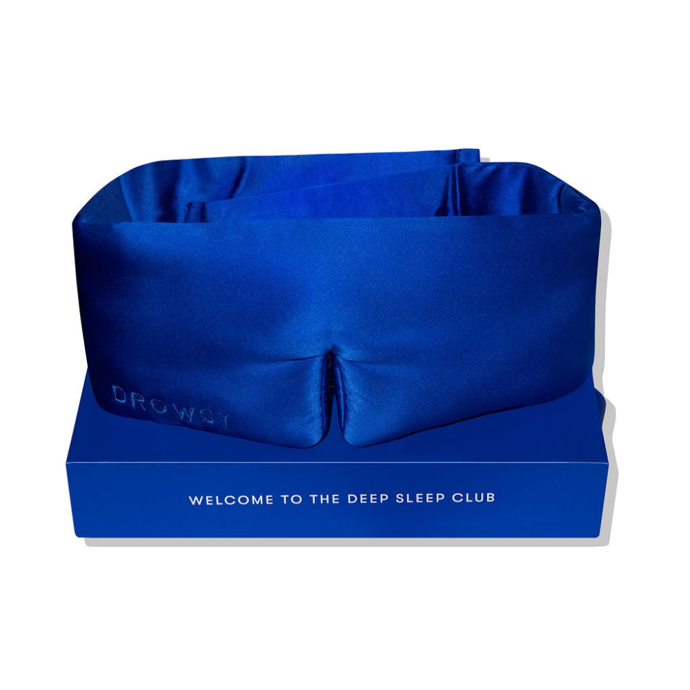 Blue sleep mask on a blue box with text 'Welcome to the Deep Sleep Club'.