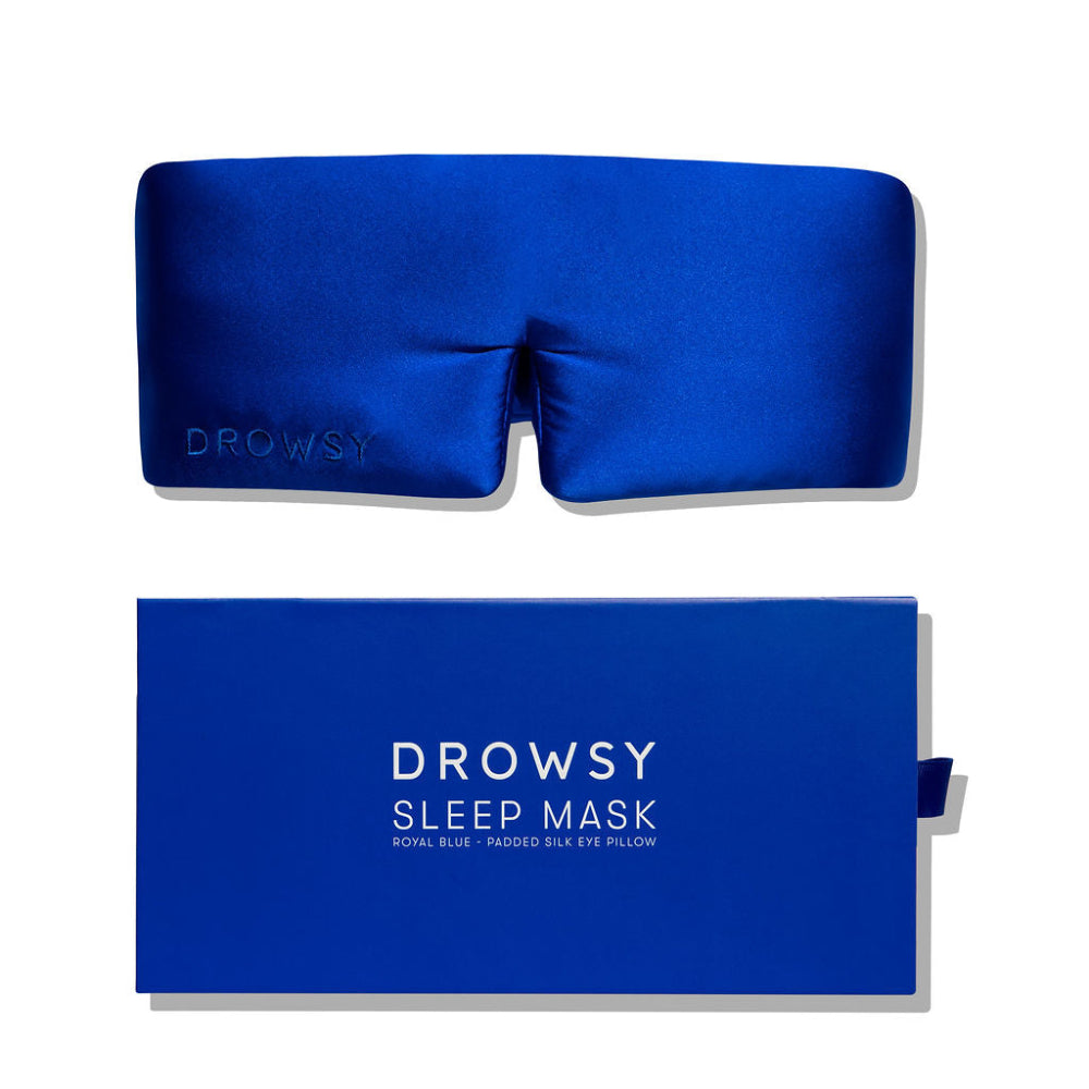 Blue sleep mask with matching coloured boxed packaging on a white background