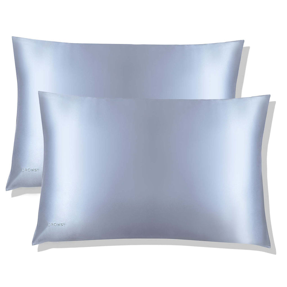 Two light blue belle silk pillowcases with a luxurious sheen on a white background