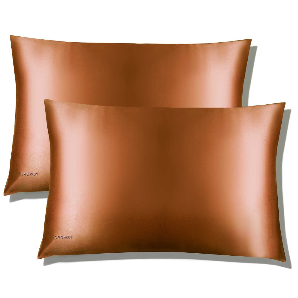 Two bronze-coloured Pumpkin Spice silk pillowcases with a smooth texture, displayed on a plain white background.