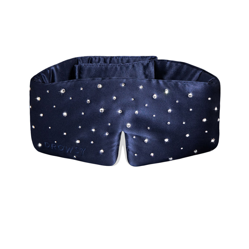 Navy blue sleep mask with sparkling Swarovski stones on a white background
