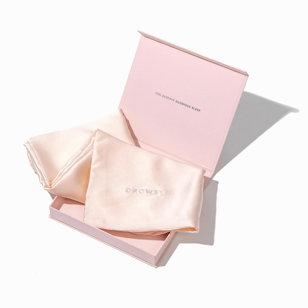 Silk pillowcase and matching open boxed packaging on a white background
