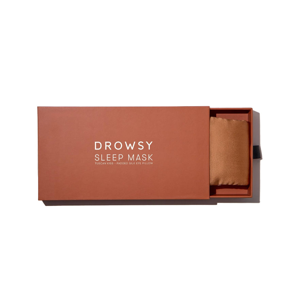 Pumpkin Spice silk sleep mask in a open box on a white background