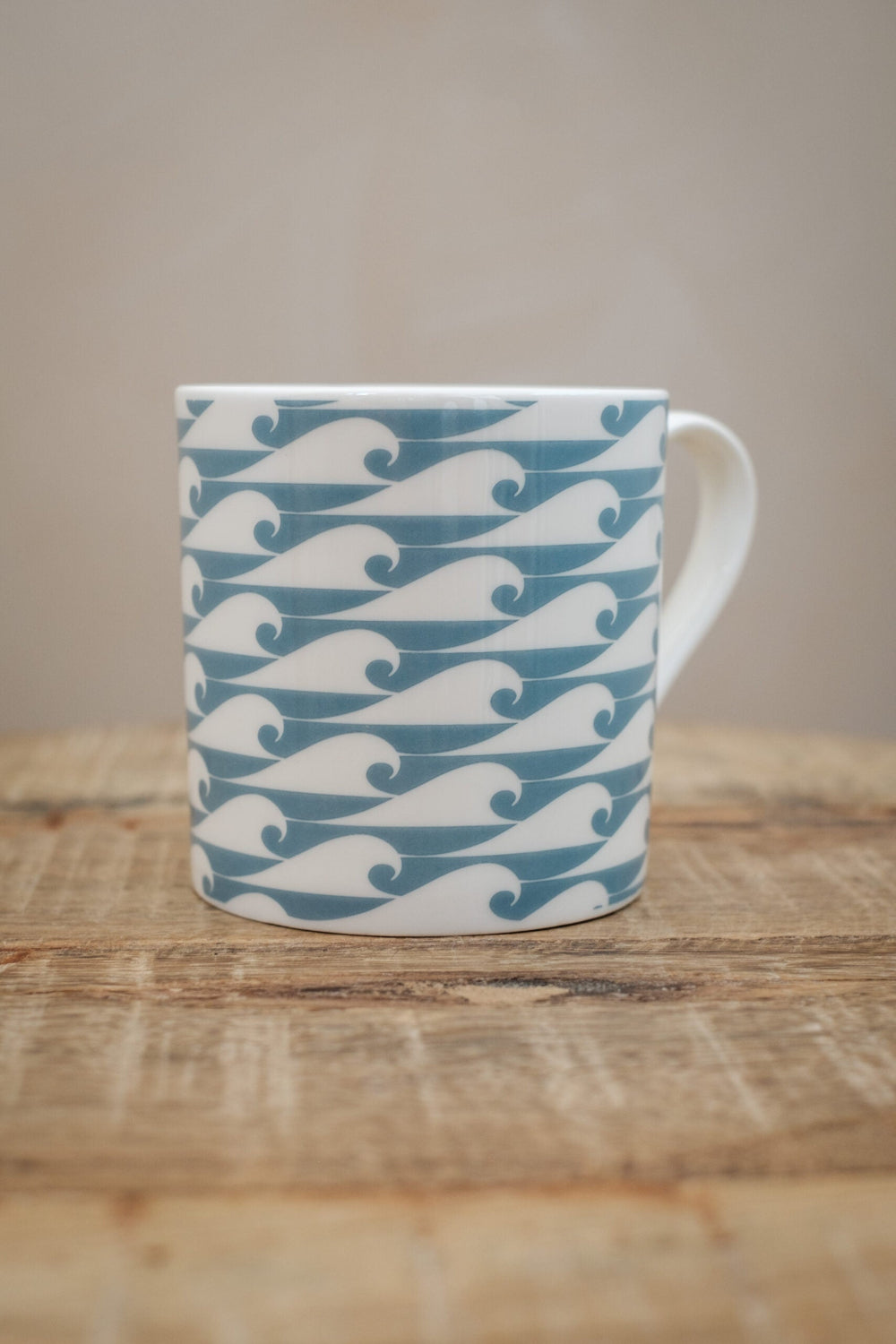 Mug with Duck egg wave pattern on a wooden surface