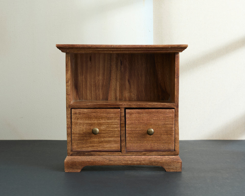 Wooden cabinet with two drawers on a grey floor and white wall background