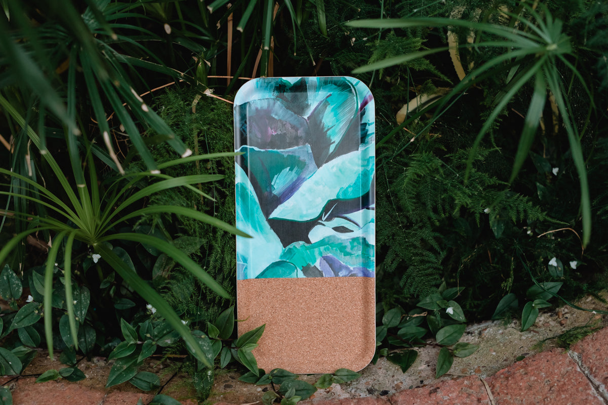 Tray with a leaf pattern on a green plant background
