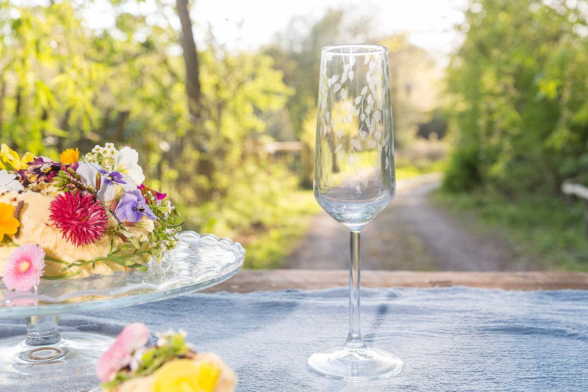 Clear glass on a table with a blurred natural background