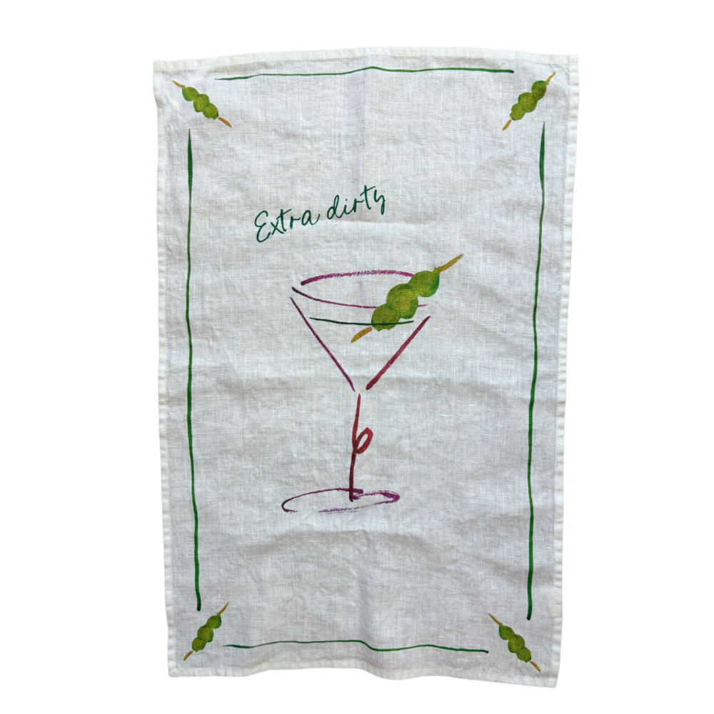 Tea towel with a martini glass and olive design on a white background