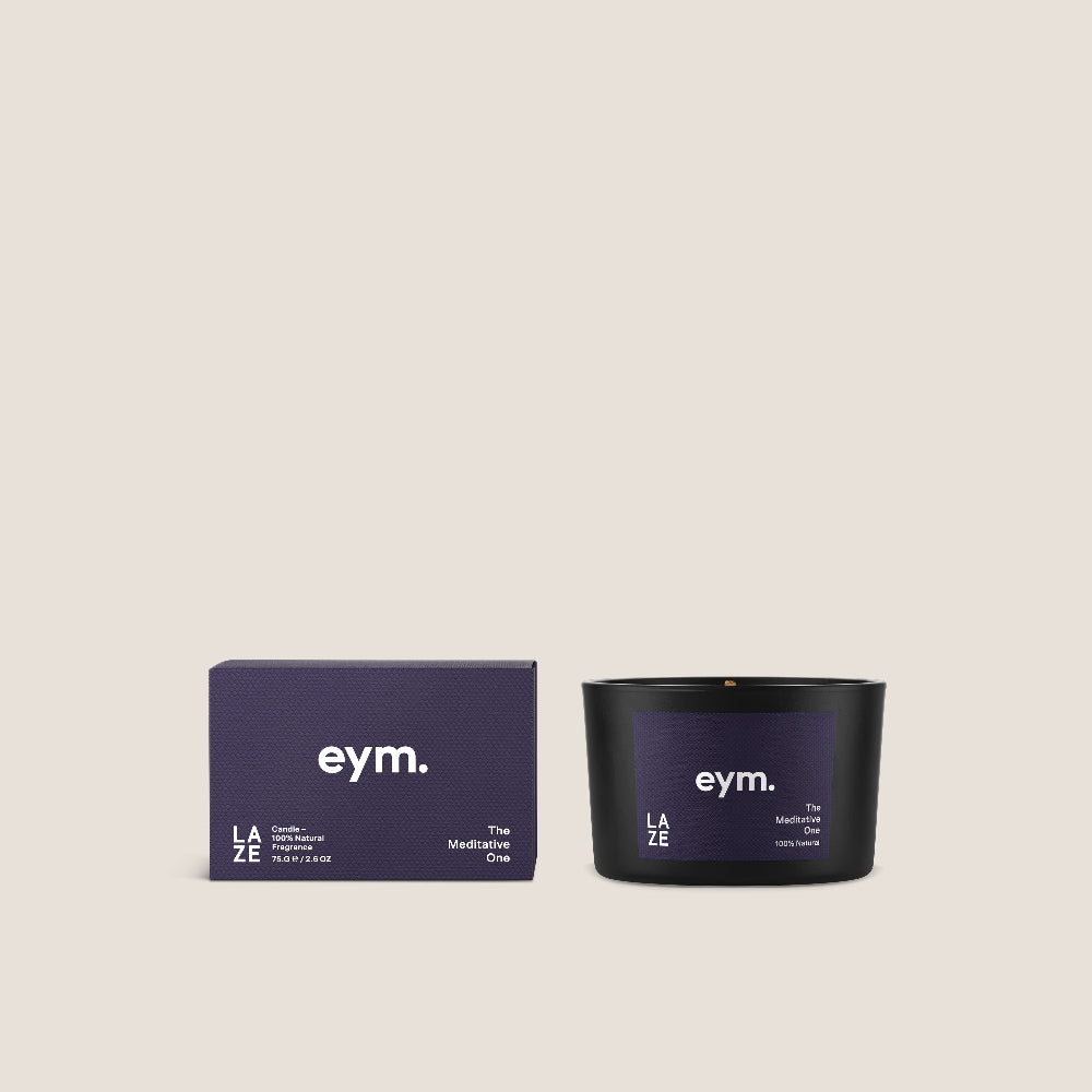 Mini Black candle and packaging with 'eym.' branding on a beige background
