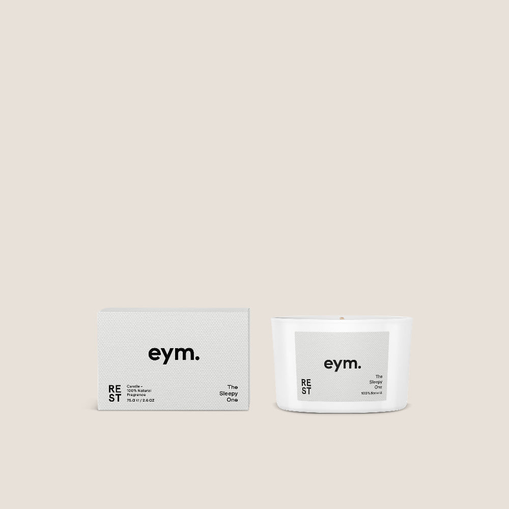eym. candle and packaging on a beige background. Candle called Rest.