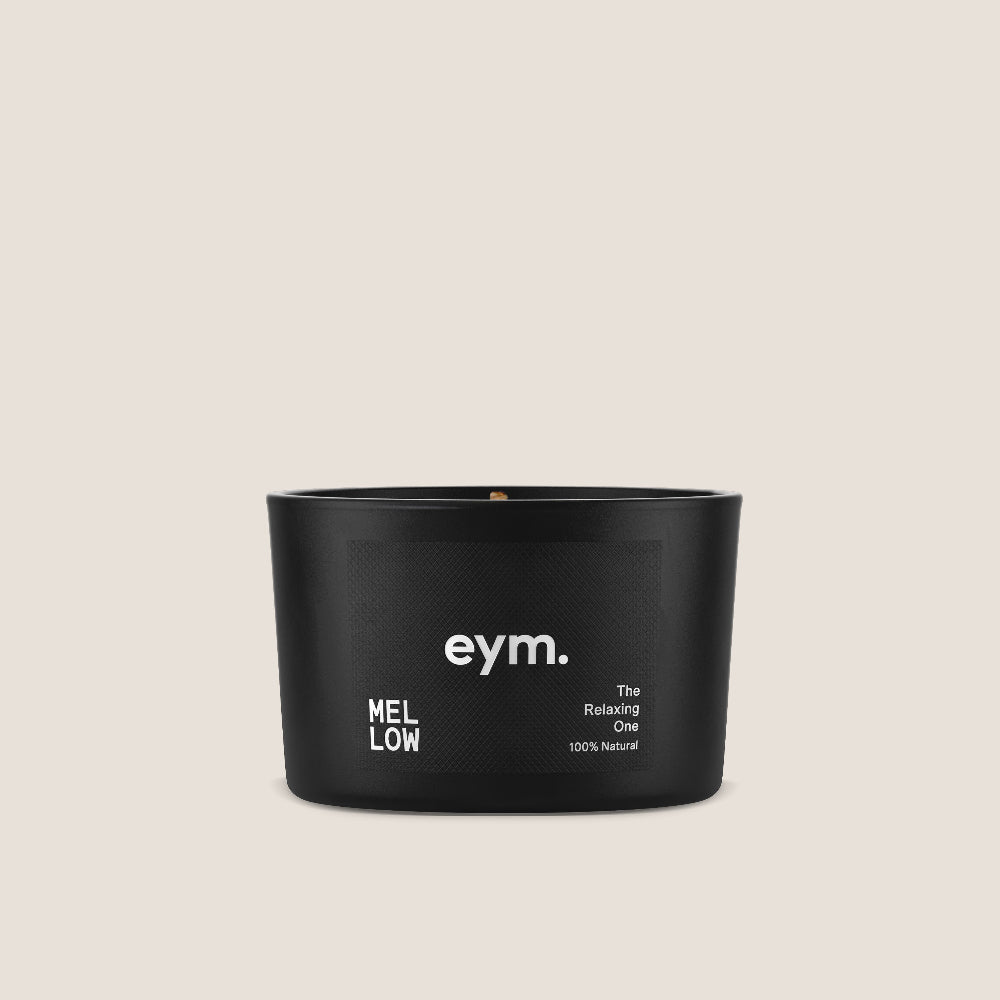 Black Mini Candle container with 'eym.' branding on a beige background