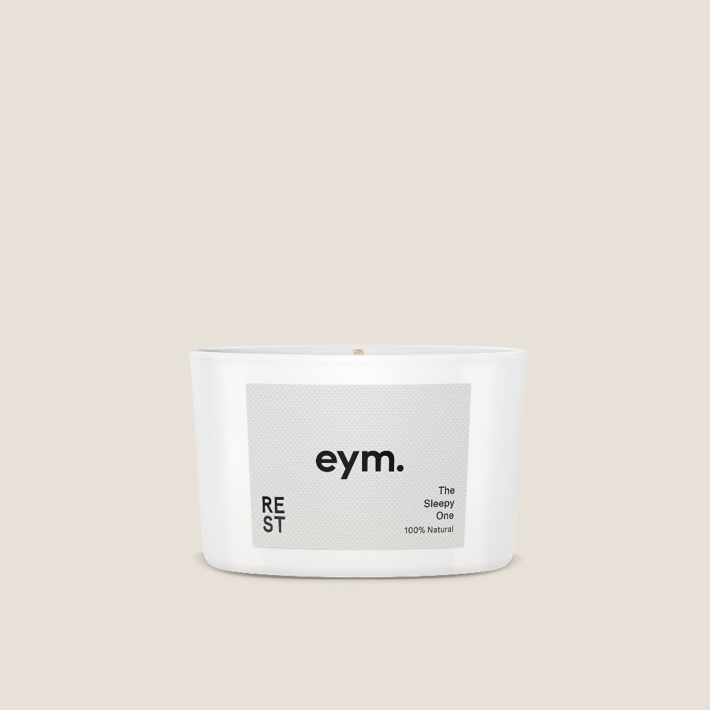 Mini Candle called Rest with 'eym.' label on a beige background