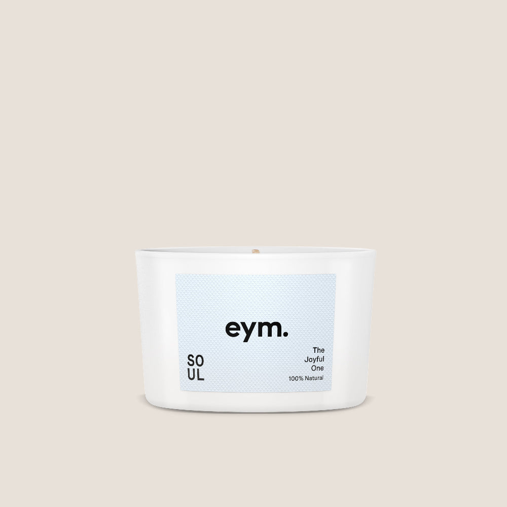 White Candle called 'Soul' made by eym with a blue label on a beige background