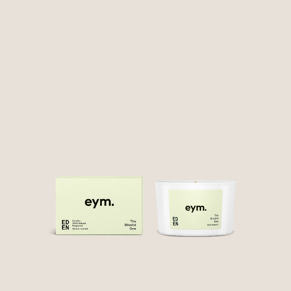 eym. candle called 'Eden' and packaging on a beige background