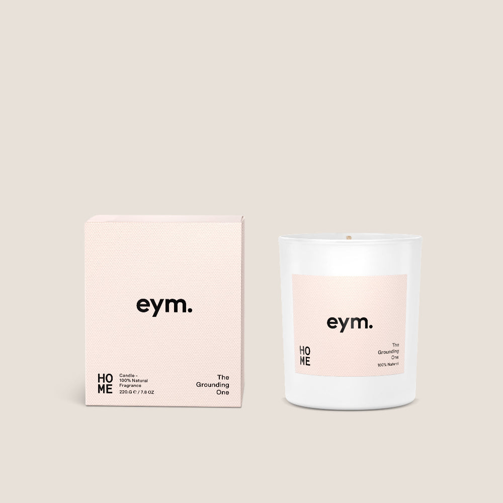 Eym Candle and packaging with 'eym.' branding on a beige background. Home scent.