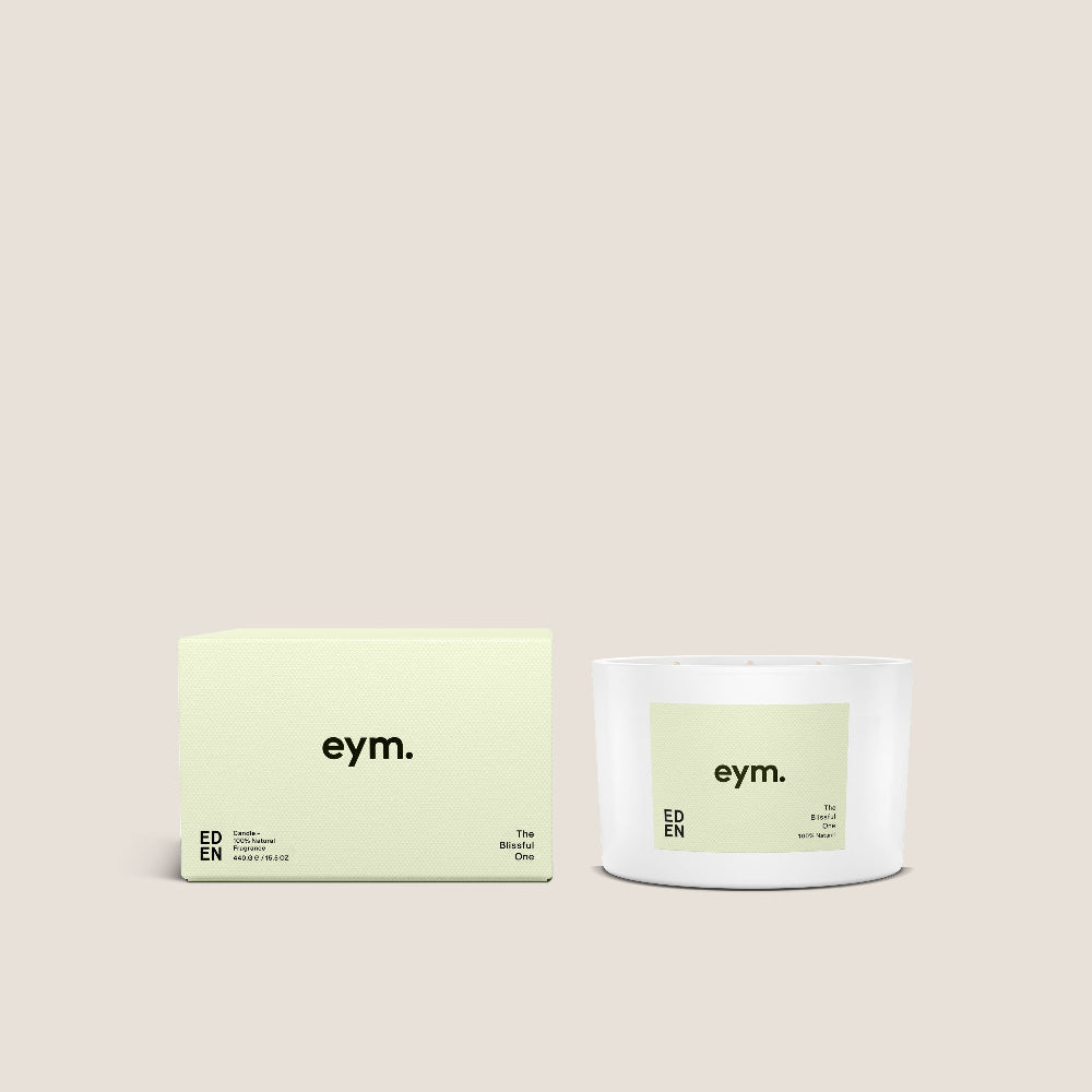 Eden Candle and packaging with 'eym.' branding on a beige background