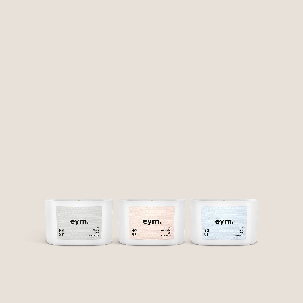 Three candles gift set with 'eym.' labels on a beige background