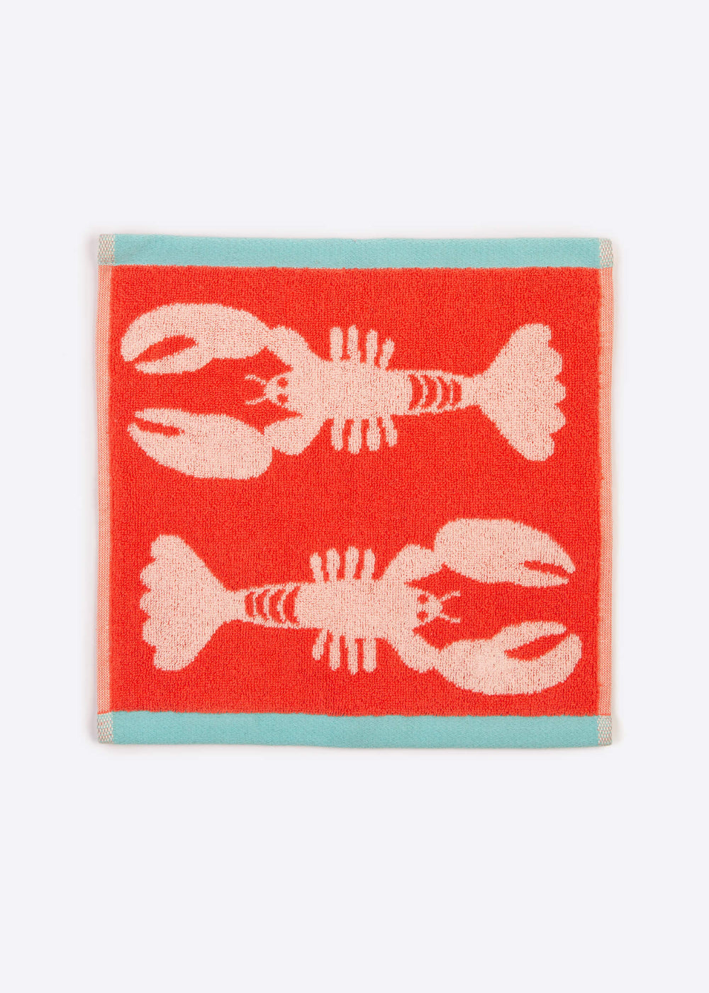 Red facecloth with pink lobster design on a white background