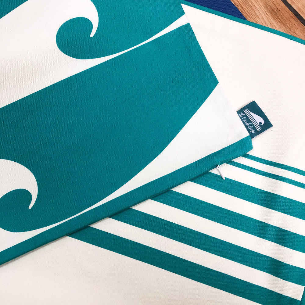 Close up of The Cornish Surfer Fistral Jade Cushion cover with waves and stripes