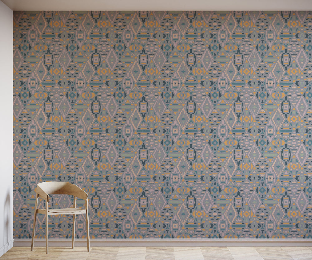 Room with Grey geometric patterned wallpaper and a chair.