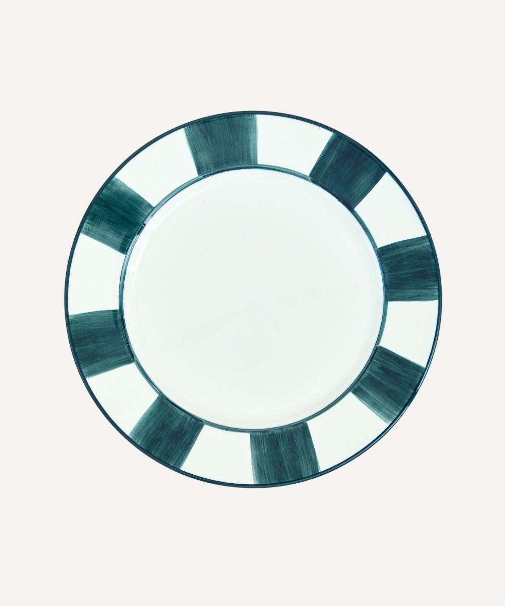 Teal Handpainted white dinner plate with stripes around border on a white background.