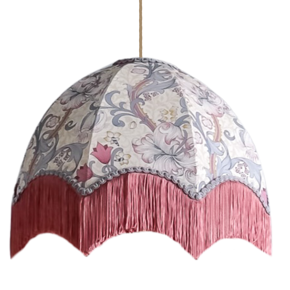 Decorative Lampshade with floral pattern and pink fringe on a white background
