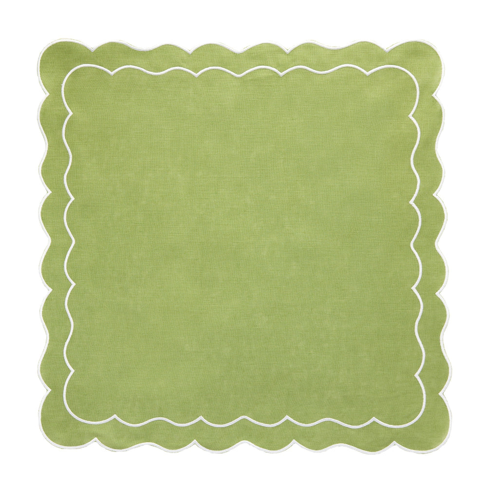 Green placemat or napkin with scalloped edge on a white background