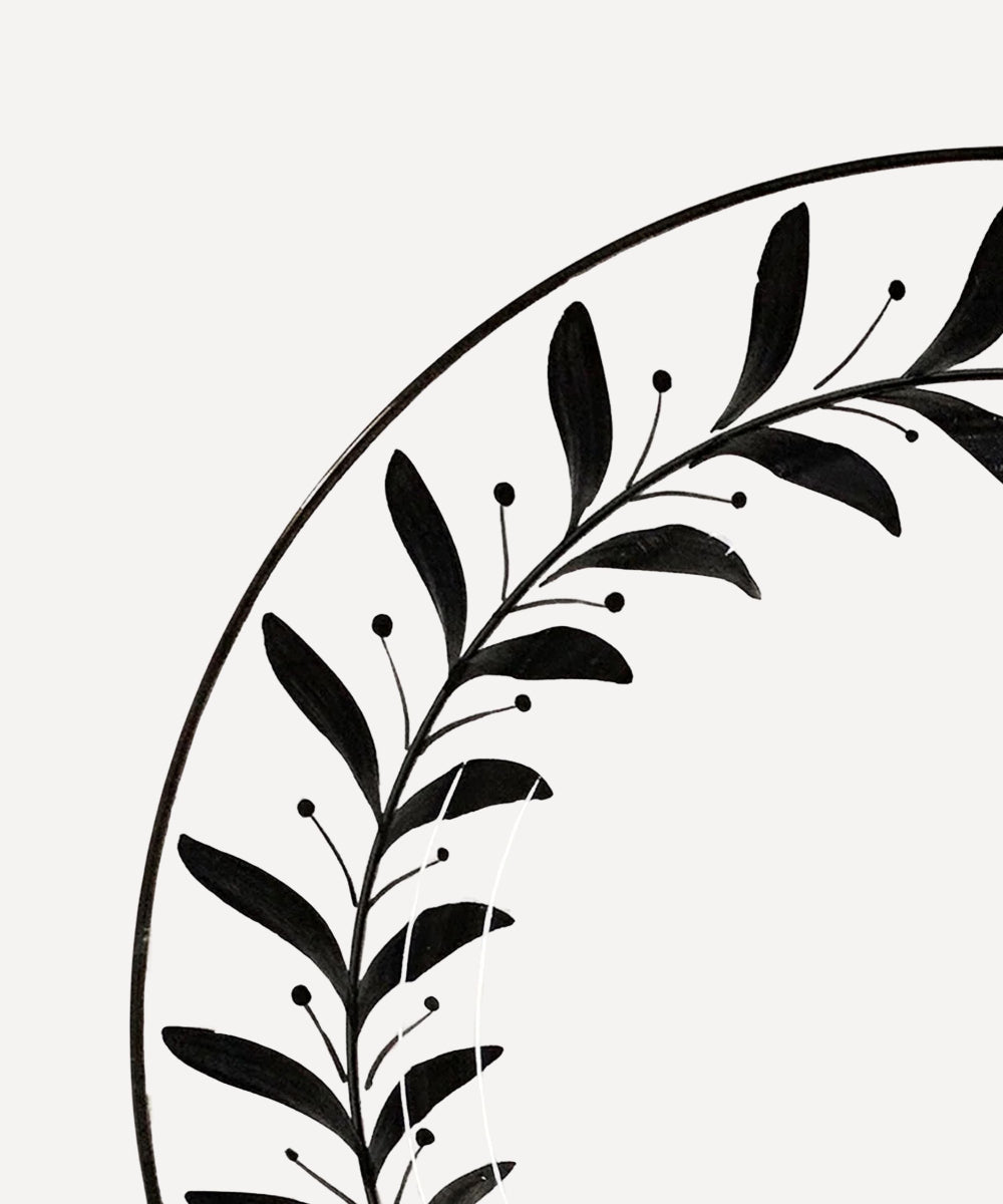 White Ceramic Side Plate closeup of Jet Black Handpainted Fern style leaves