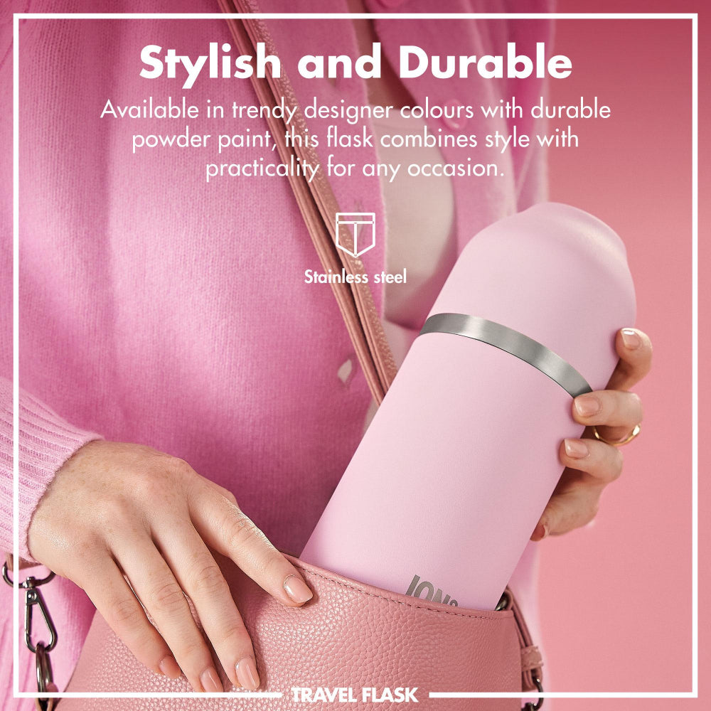 Pink travel flask held by a hand with text about its style and durability.
